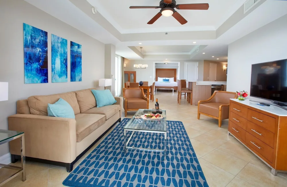 Open-plan suite living area with bedroom beyond at Divi Aruba Phoenix Beach Resort.