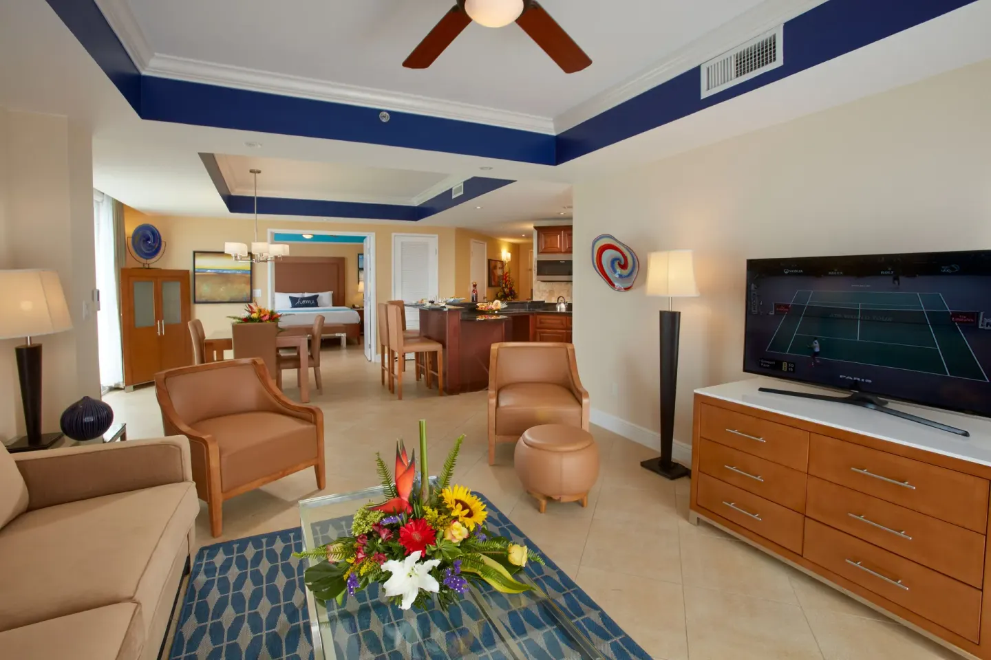 Spacious suite living room with dining and kitchen areas at Divi Aruba Phoenix Beach Resort.