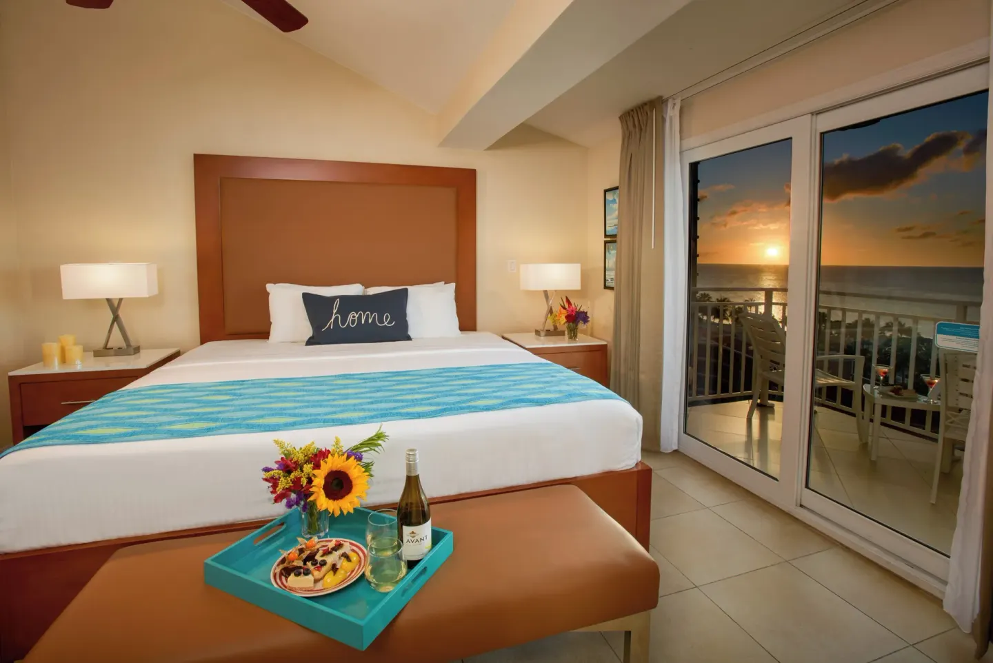 Sunset ocean-view bedroom with king bed at Divi Aruba Phoenix Beach Resort.