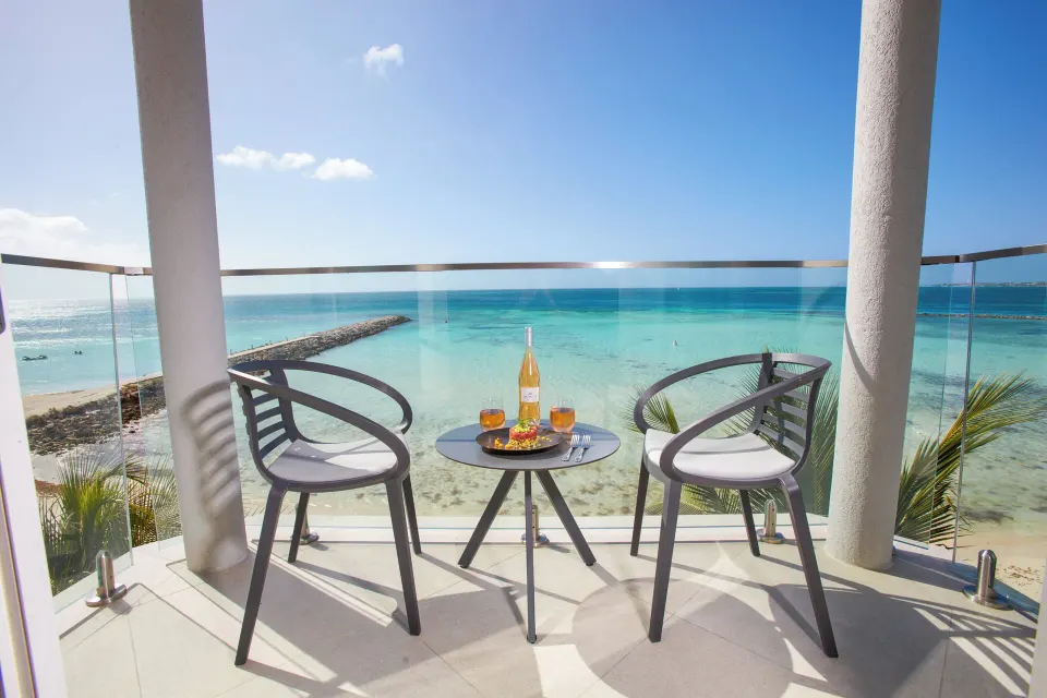 Beach Tower Studio Suite balcony with ocean view at Divi Aruba Phoenix Beach Resort.