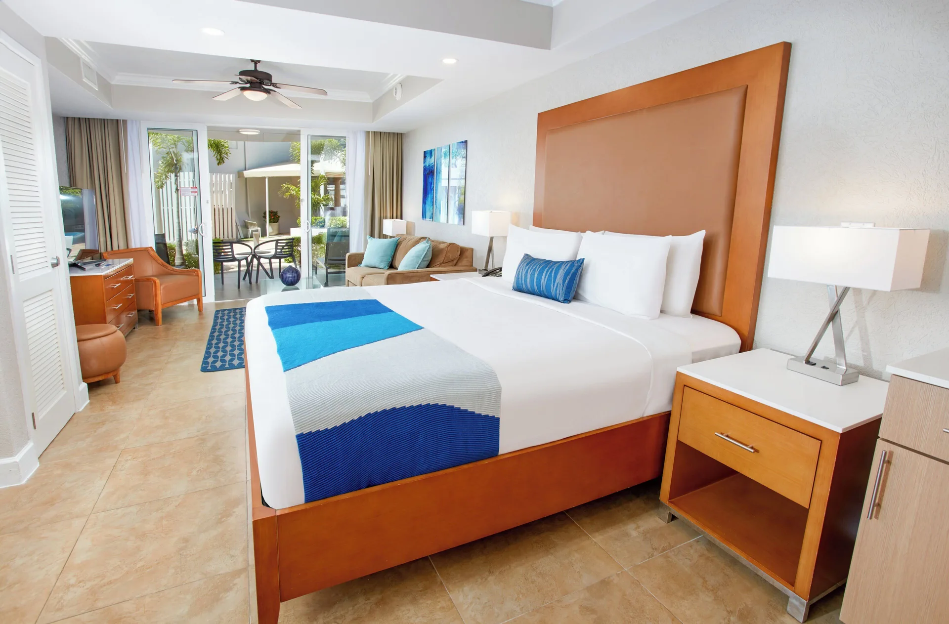 Beach Tower Studio Suite king bed and seating area at Divi Aruba Phoenix Beach Resort.