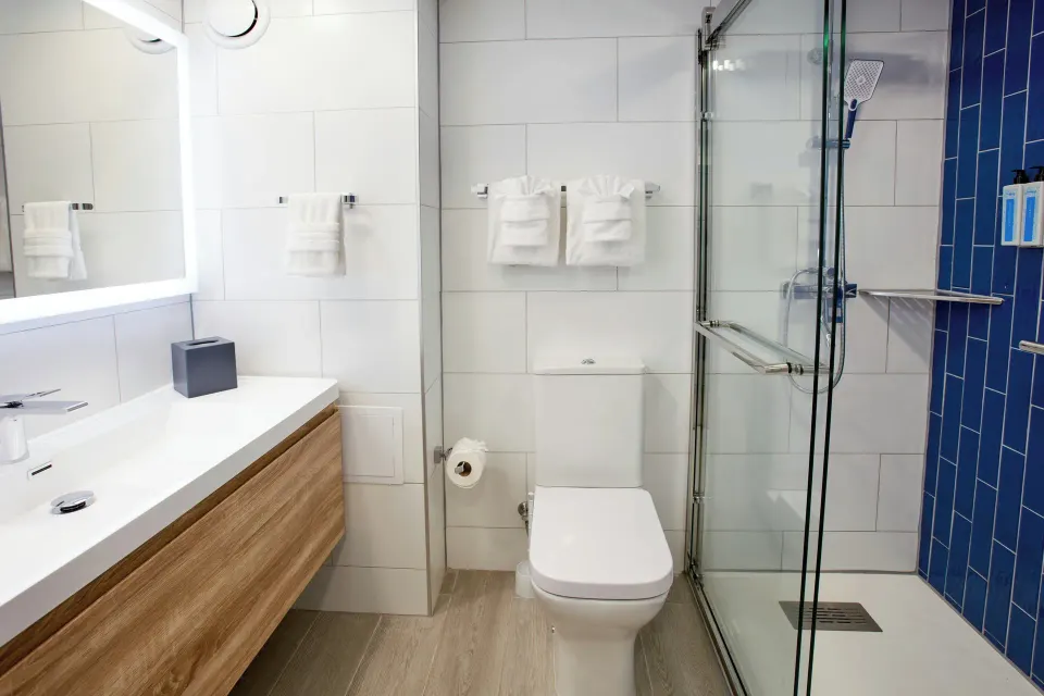 Studio Suite bathroom with glass shower at Divi Aruba Phoenix Beach Resort.