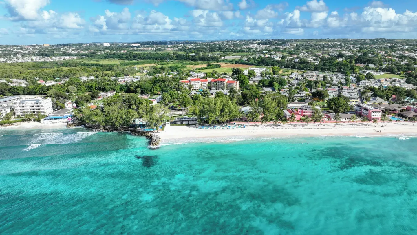 Aerial view of turquoise water and the beachfront near Divi Southwinds Beach Resort.
