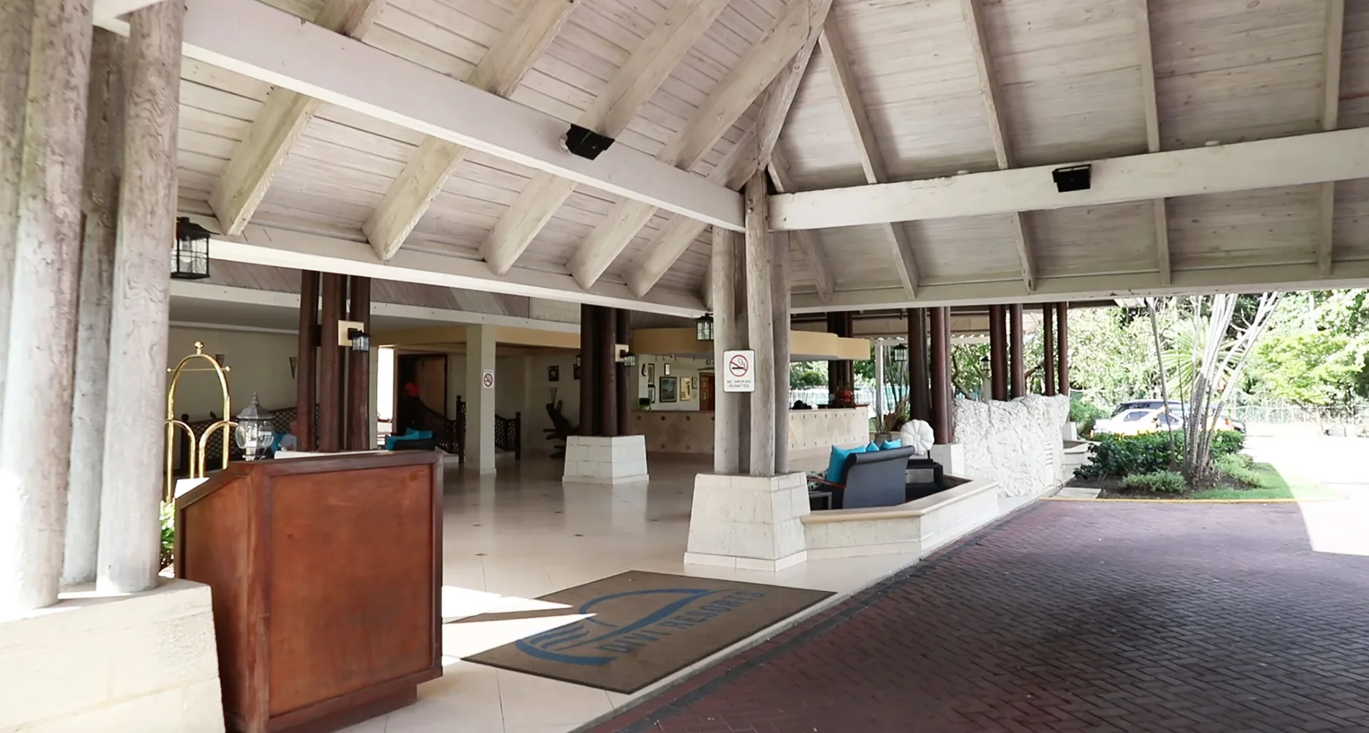 Covered entrance and lobby walkway with columns at Divi Southwinds Beach Resort.