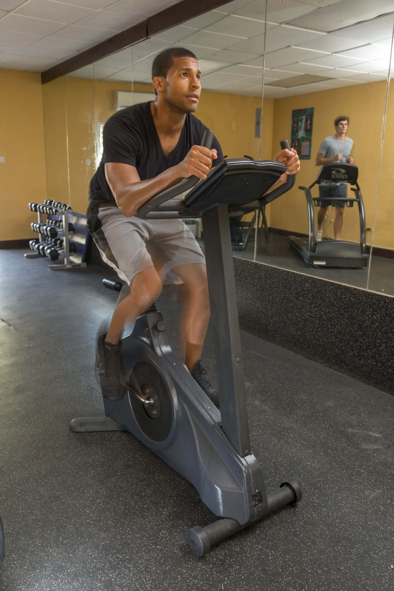 Guest using an exercise bike in the fitness room at Divi Southwinds Beach Resort.