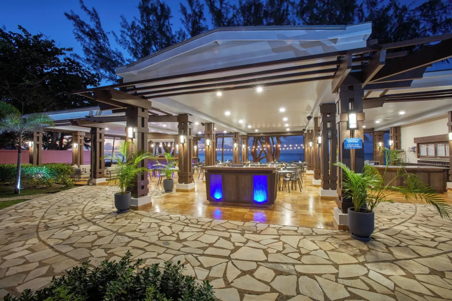 Covered beachfront bar and dining pavilion at dusk at Divi Southwinds Beach Resort.