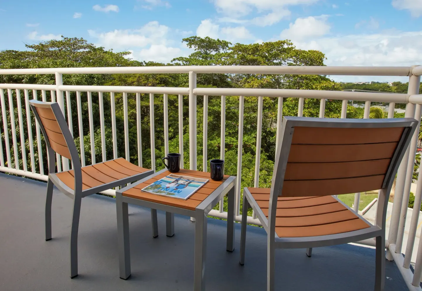 One-bedroom garden view suite balcony seating at Divi Southwinds Beach Resort.
