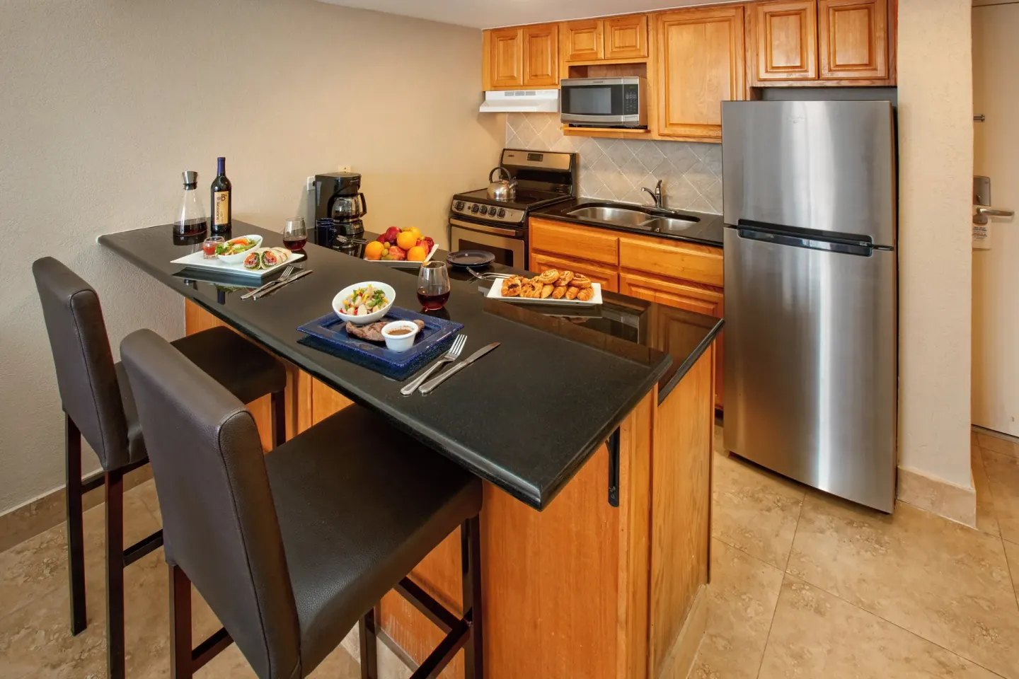 One-bedroom garden view suite kitchen and breakfast bar at Divi Southwinds Beach Resort.