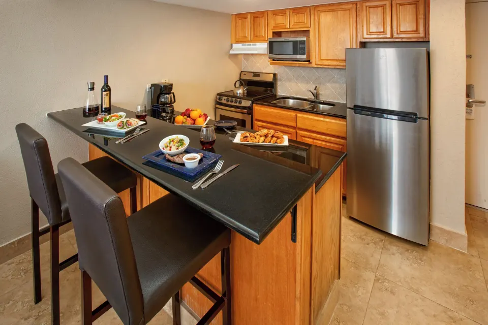 One-bedroom garden view suite kitchen and breakfast bar at Divi Southwinds Beach Resort.