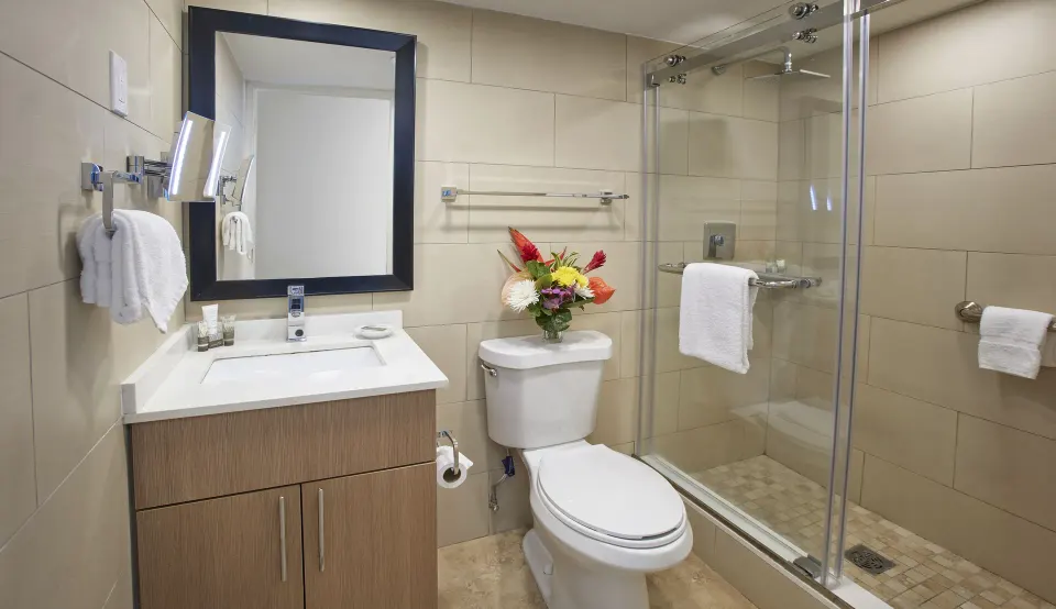 Two-bedroom suite bathroom with glass shower at Divi Southwinds Beach Resort.