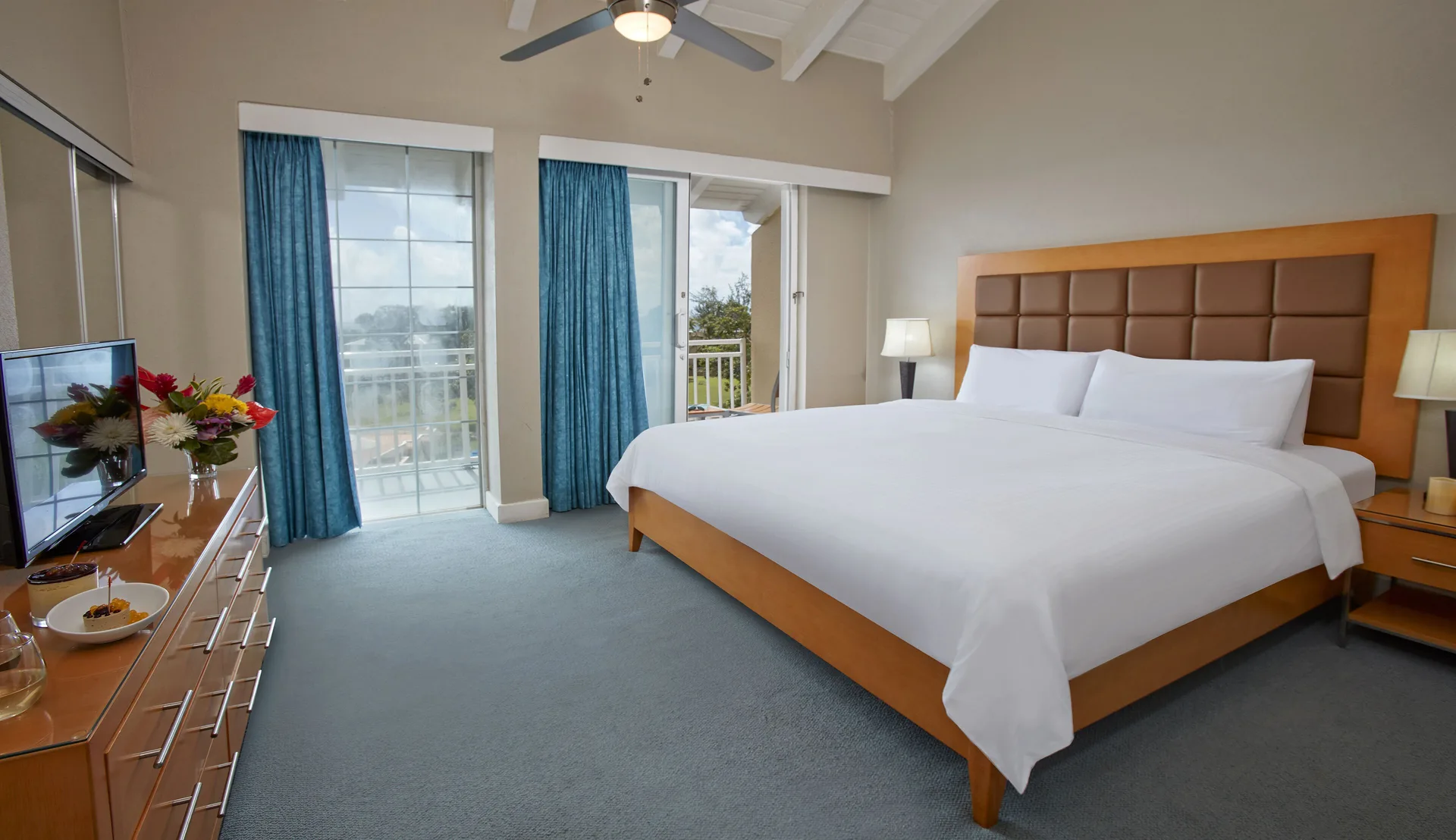 King bedroom with balcony doors in a two-bedroom suite at Divi Southwinds Beach Resort.