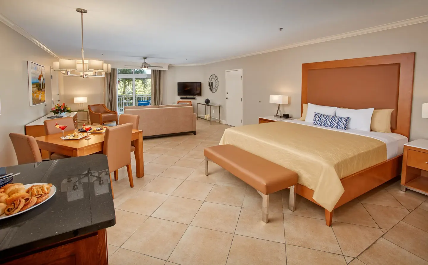 Golf Villa Studio Suite with king bed and dining area at Divi Village Golf & Beach Resort.
