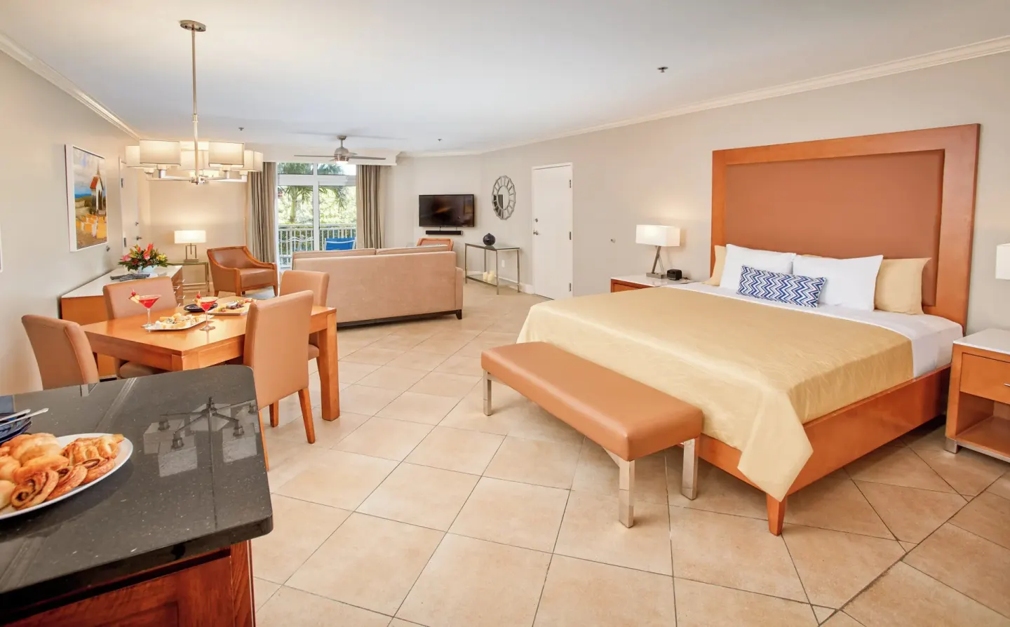Golf Villa Studio Suite with king bed, table, and lounge at Divi Village Golf & Beach Resort.