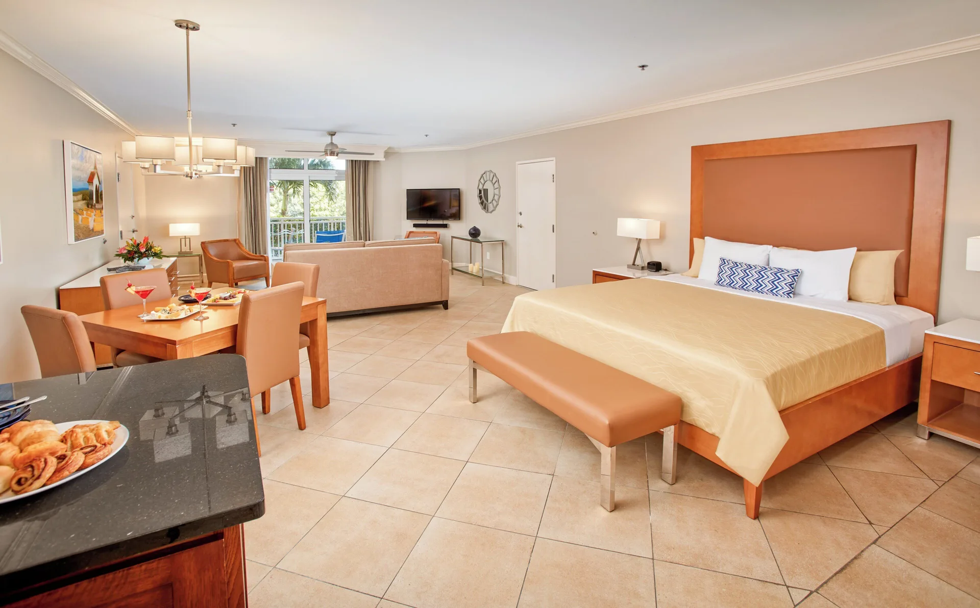 Golf Villa Studio Suite with king bed, table, and lounge at Divi Village Golf & Beach Resort.