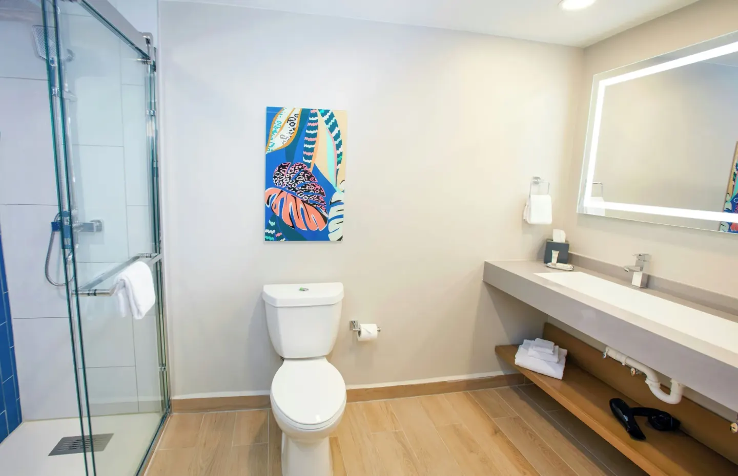 Studio Suite bathroom with glass shower and vanity at Divi Village Golf & Beach Resort.