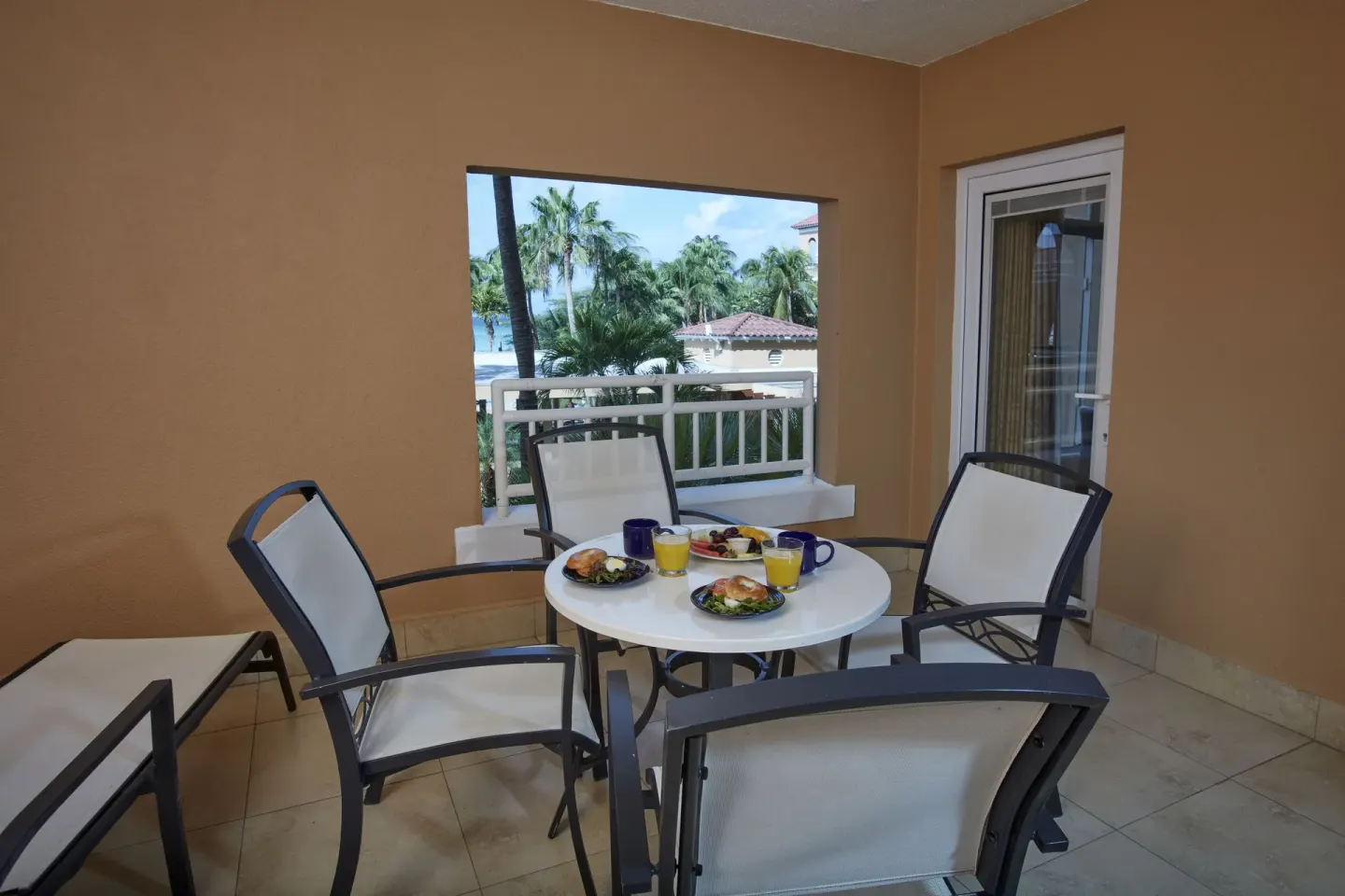 One Bedroom Suite balcony dining table at Divi Village Golf & Beach Resort.