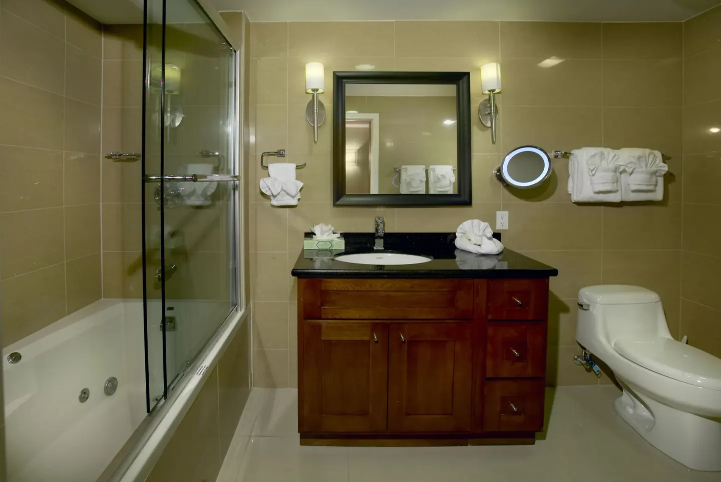 One Bedroom Suite bathroom with tub and vanity at Divi Village Golf & Beach Resort.