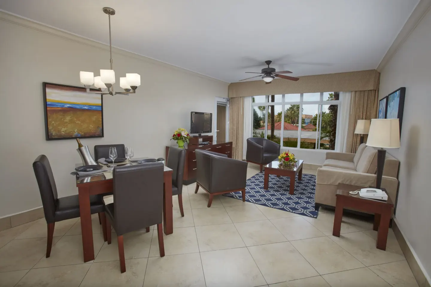 One Bedroom Suite living room with dining set at Divi Village Golf & Beach Resort.