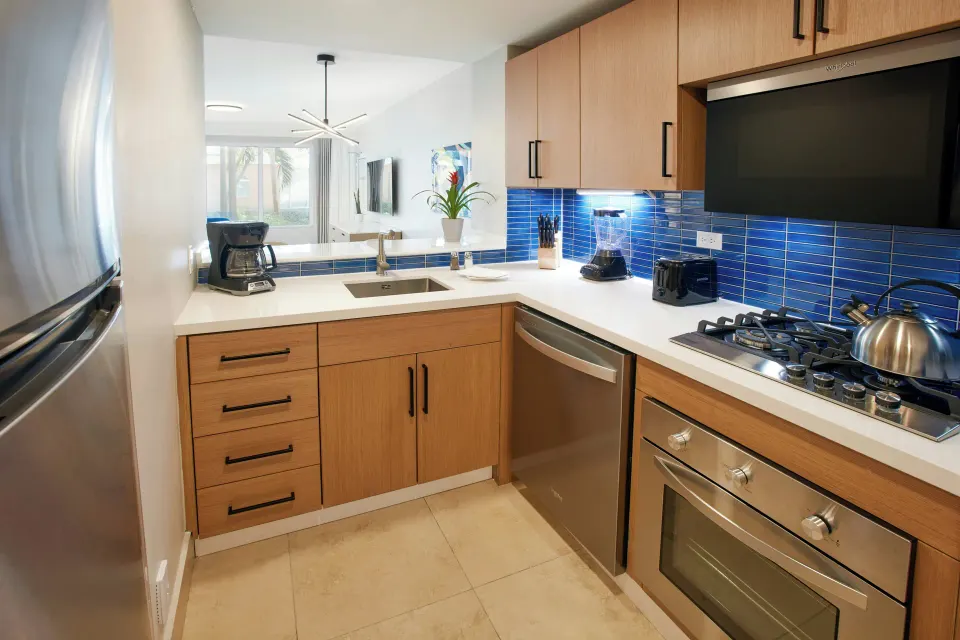 One Bedroom Suite modern kitchen with blue tile at Divi Village Golf & Beach Resort.