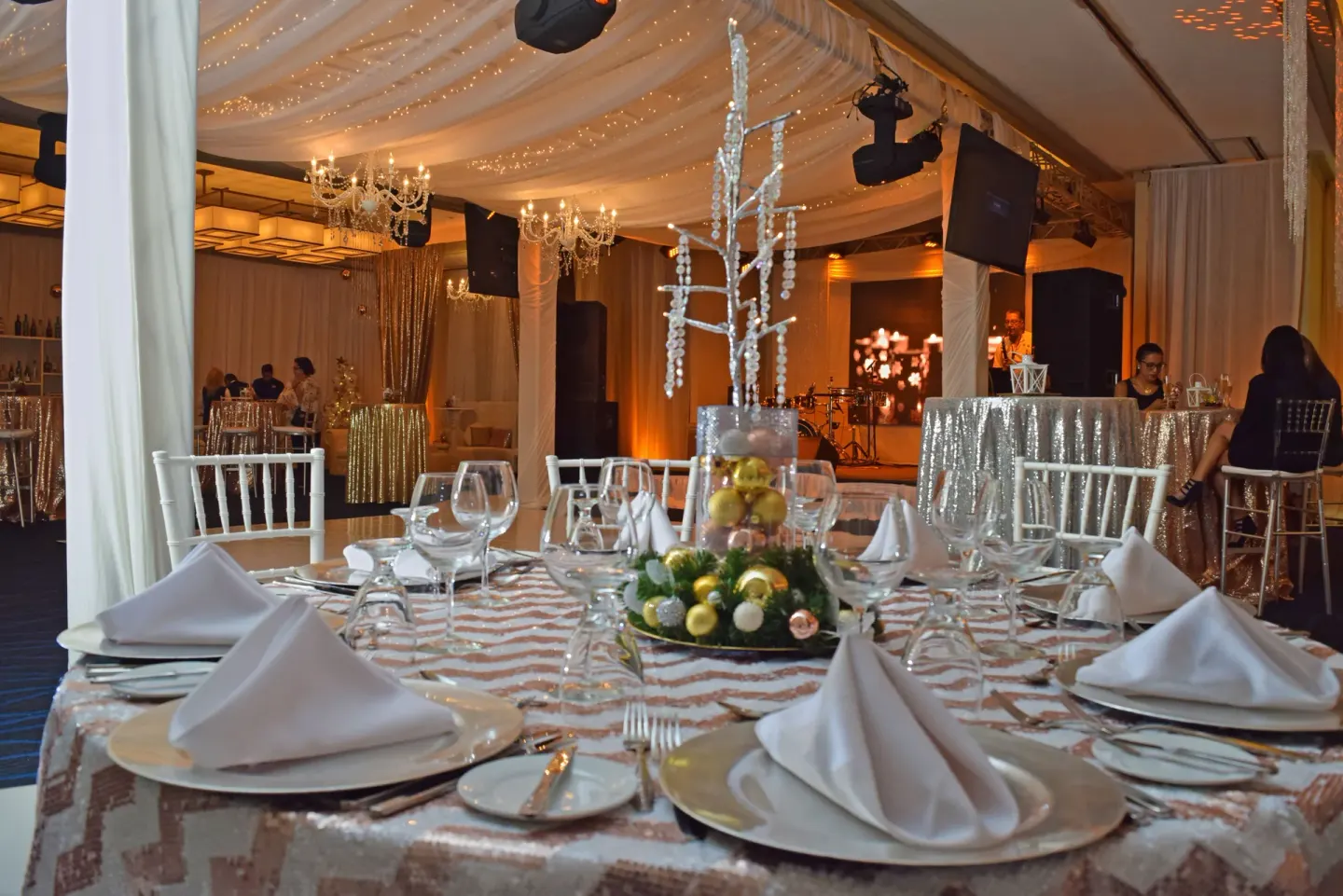 A formal event table is set under chandeliers at Divi Village Golf & Beach Resort.