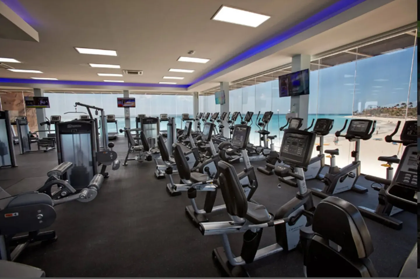 Fitness center with cardio machines overlooking the beach at Divi Village Villas.