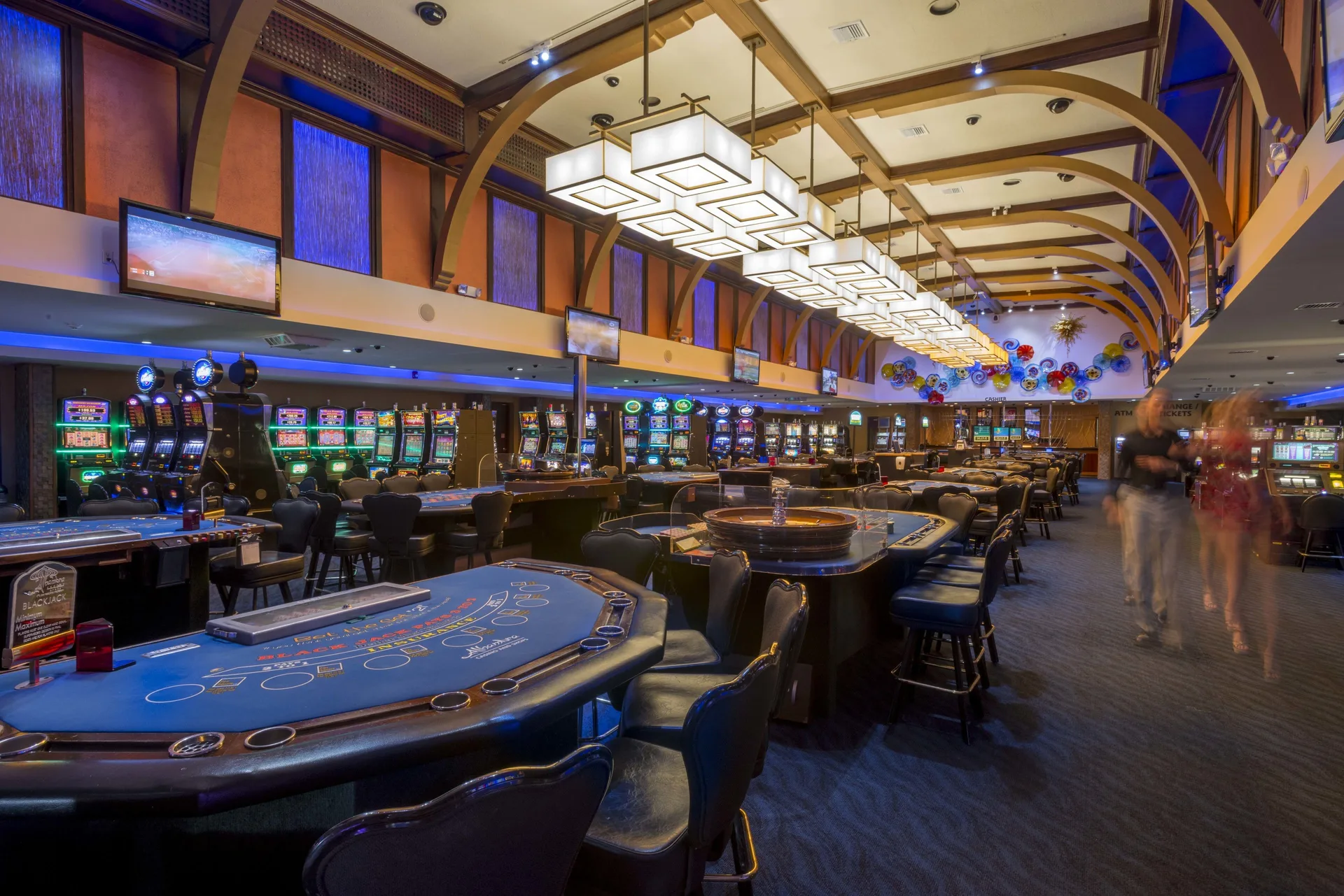 Casino floor with table games and slot machines at Divi Village Villas.