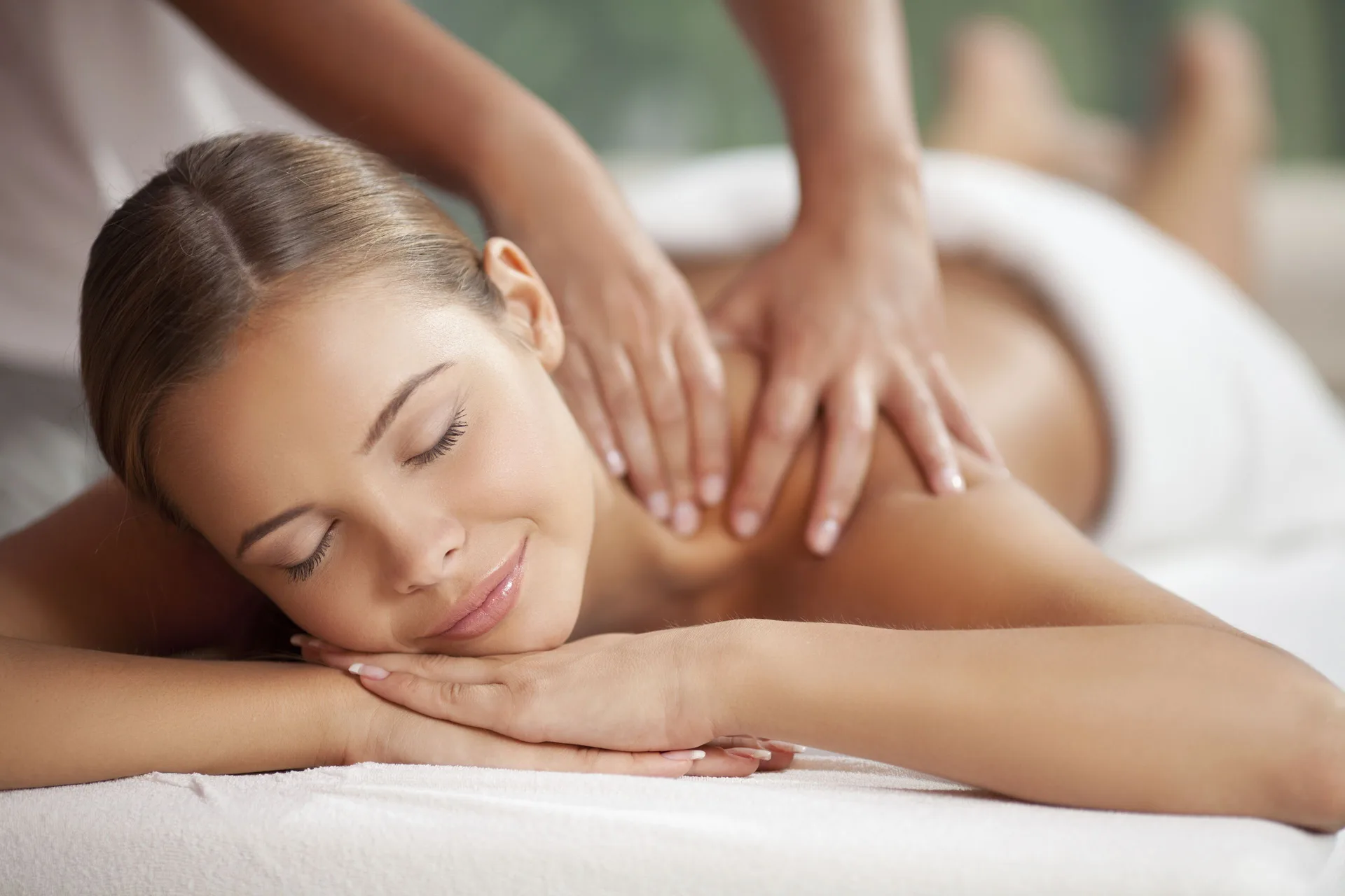 Guest receiving a back massage on a spa table at Divi Village Villas.