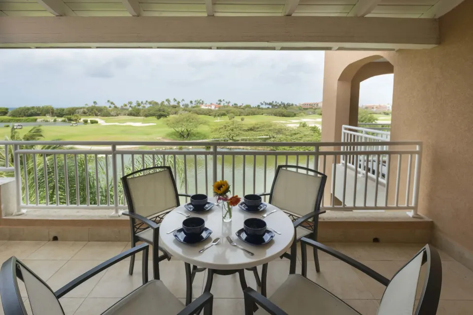 Studio suite balcony dining table overlooking the golf course at Divi Village Villas.
