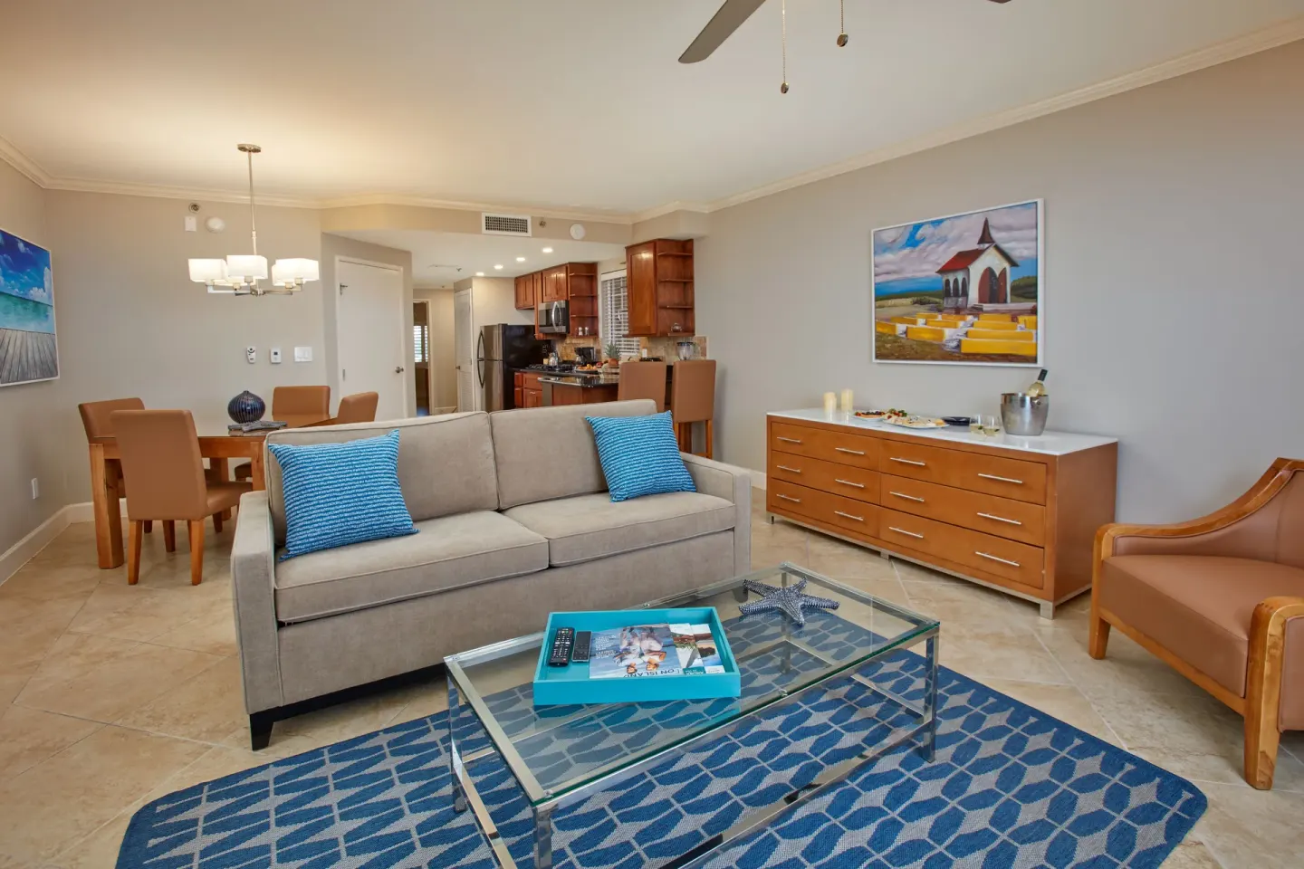 One-bedroom suite living room, dining area, and kitchen at Divi Village Villas.
