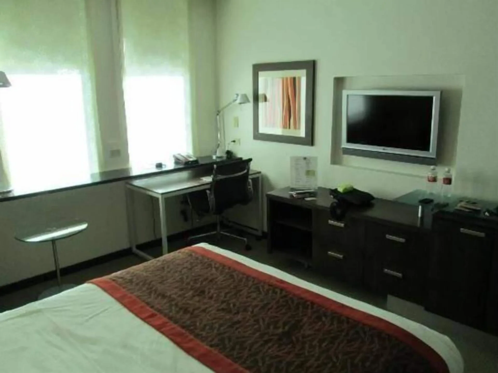 Standard Room with bed, desk, and wall-mounted TV at DoubleTree San Juan.