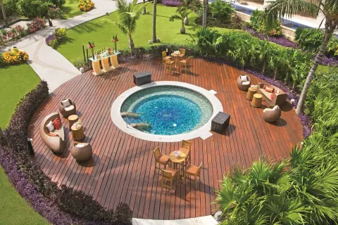 Garden deck with circular spa pool at Dreams Riviera Cancun Resort & Spa.