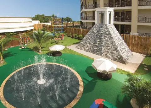 Kids water play area with fountain and pyramid at Dreams Riviera Cancun Resort & Spa.