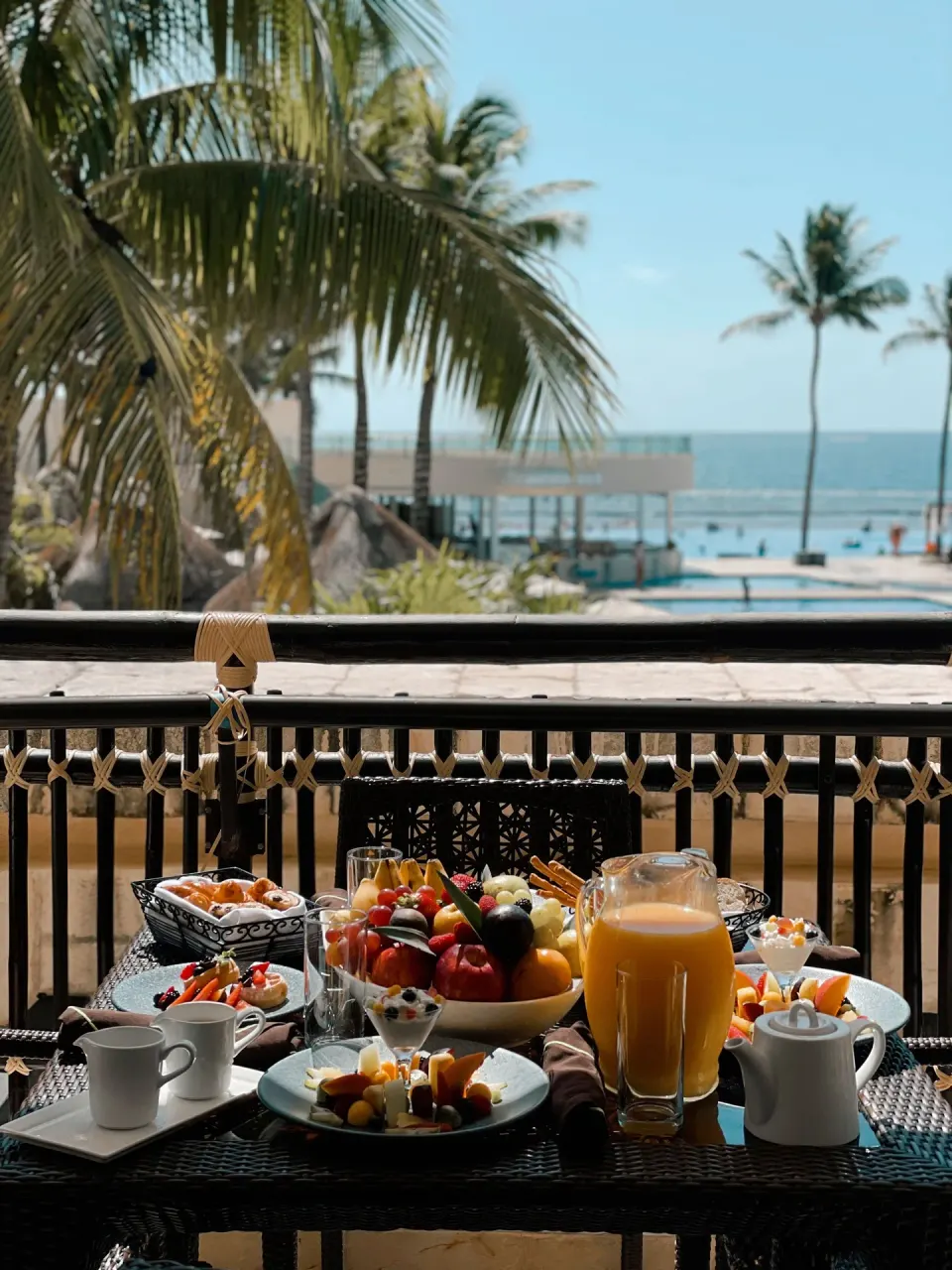 Balcony breakfast with fruit and juice at Dreams Riviera Cancun Resort & Spa.