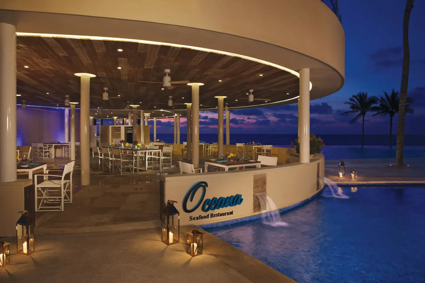 Oceana seafood restaurant terrace beside the pool at Dreams Riviera Cancun Resort & Spa.