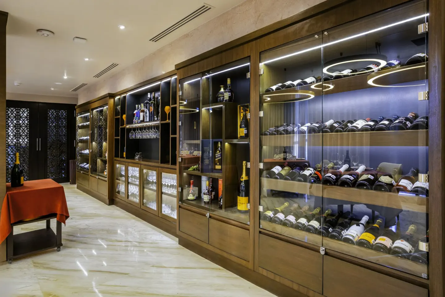 Wine display corridor with glass cabinets at Dreams Riviera Cancun Resort & Spa.