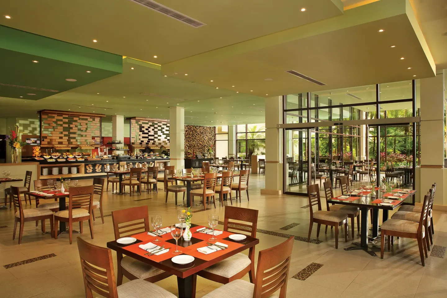 Buffet dining room with garden-facing windows at Dreams Riviera Cancun Resort & Spa.