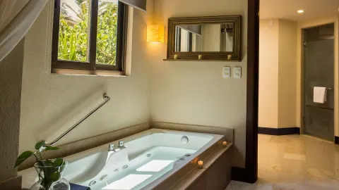Oceanfront Governor Suite bathroom tub at Dreams Riviera Cancun Resort & Spa.