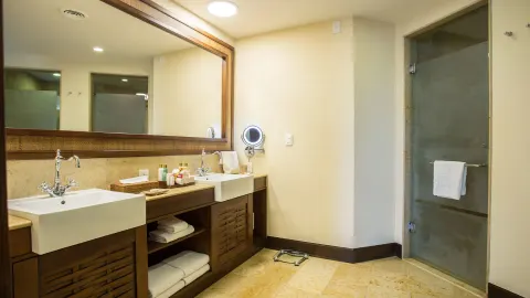 Oceanfront Governor Suite bathroom vanities at Dreams Riviera Cancun Resort & Spa.