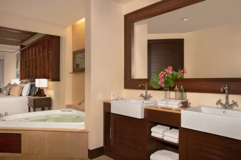 premium Ocean Front Honeymoon Suite bathroom at Dreams Riviera Cancun Resort & Spa with double sinks.