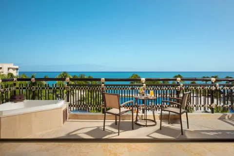 premium ocean view balcony seating at Dreams Riviera Cancun Resort & Spa.