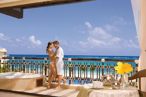 premium ocean view balcony with soaking tub at Dreams Riviera Cancun Resort & Spa.