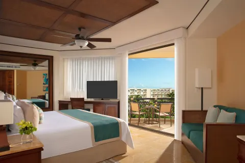 premium Tropical View room with king bed and balcony at Dreams Riviera Cancun Resort & Spa.
