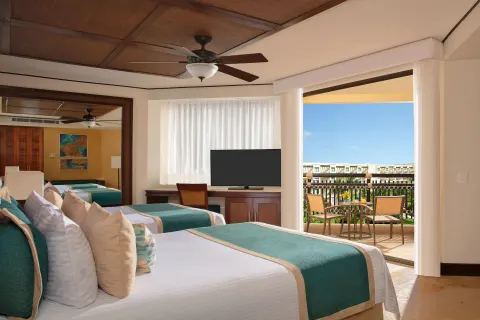 premium Tropical View room with two beds and balcony at Dreams Riviera Cancun Resort & Spa.