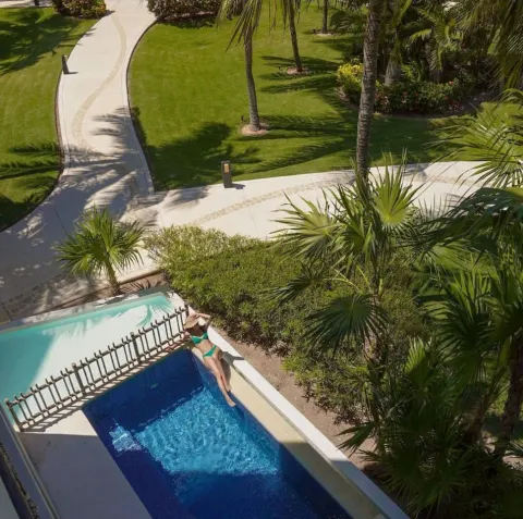 Private plunge pool by tropical paths at Dreams Riviera Cancun Resort & Spa.