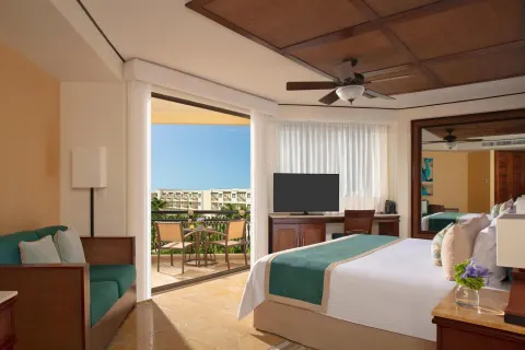 Premium Deluxe Tropical & Garden View king room with balcony at Dreams Riviera Cancun Resort & Spa.
