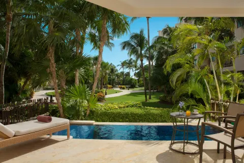 Premium Deluxe plunge pool patio with garden view at Dreams Riviera Cancun Resort & Spa.