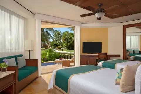Premium Deluxe room with two beds and patio plunge pool at Dreams Riviera Cancun Resort & Spa.
