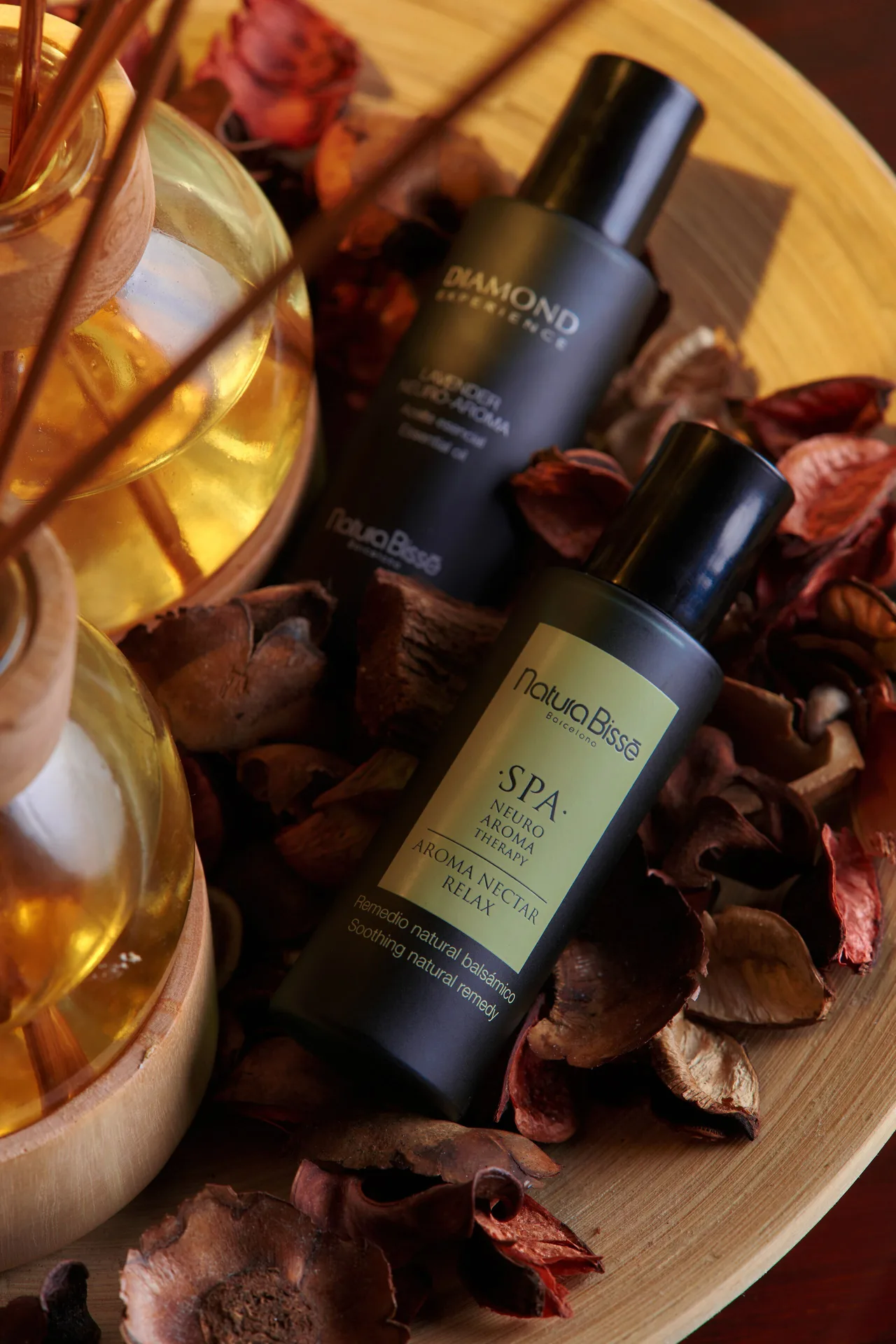 Spa bottles, reed diffusers, and dried petals are arranged at Eden Roc Cap Cana.
