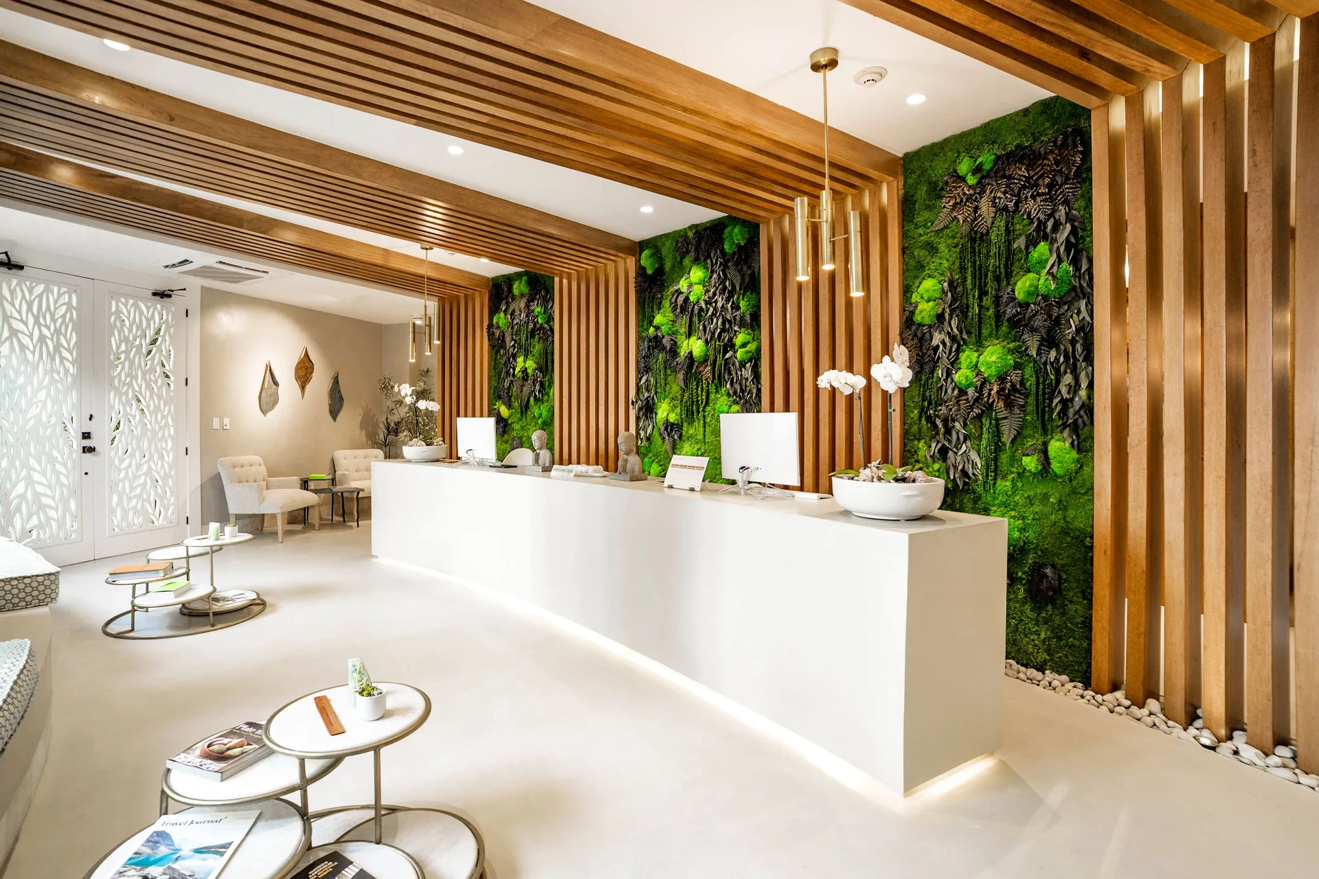 Spa reception with wood slats and green living walls at Eden Roc Cap Cana.