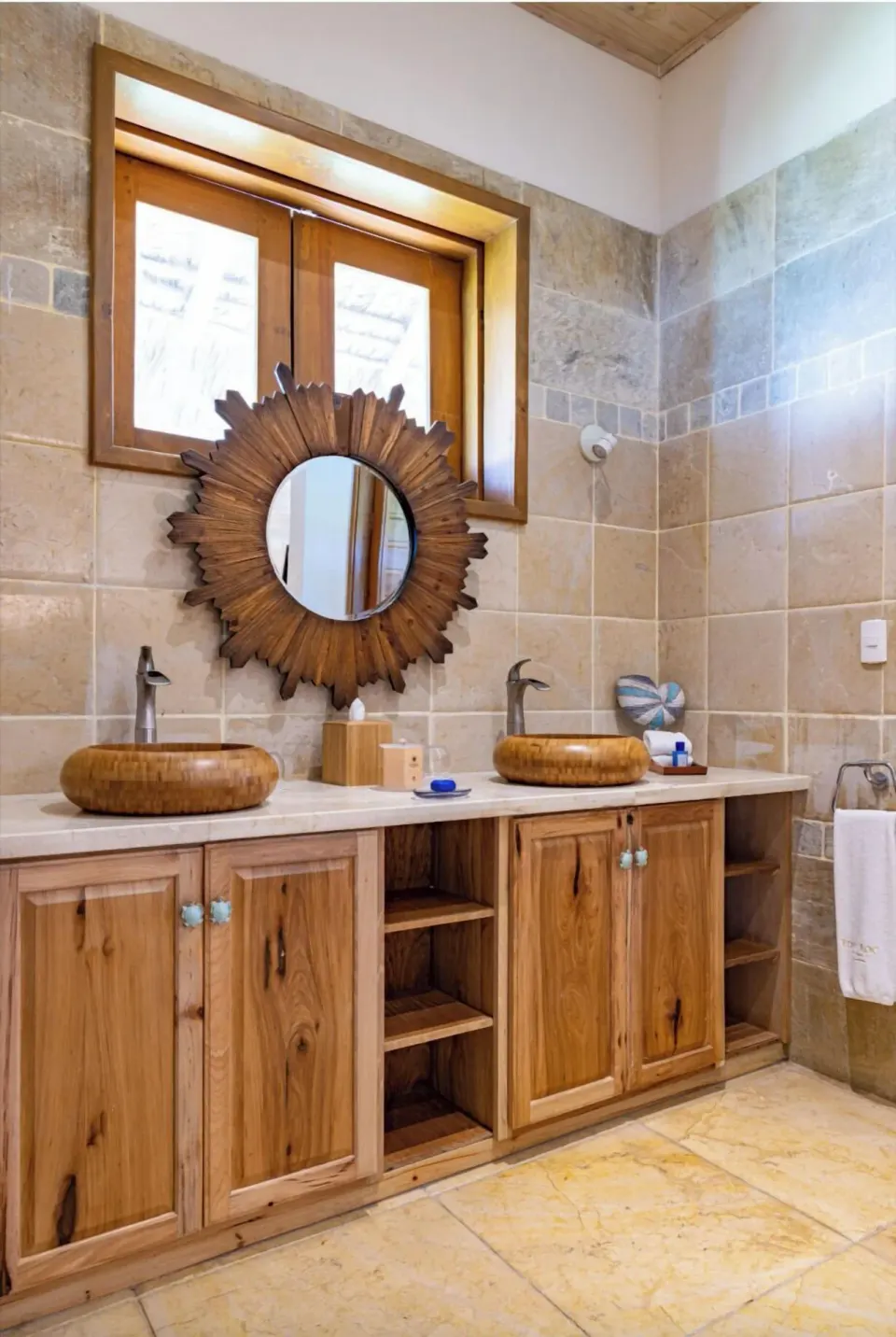 Oceanfront bungalow bathroom vanity with twin vessel sinks at Eden Roc Cap Cana.